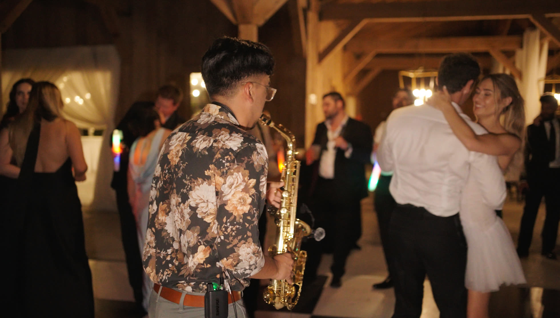 Bride and groom dancing with Jorge on saxophone