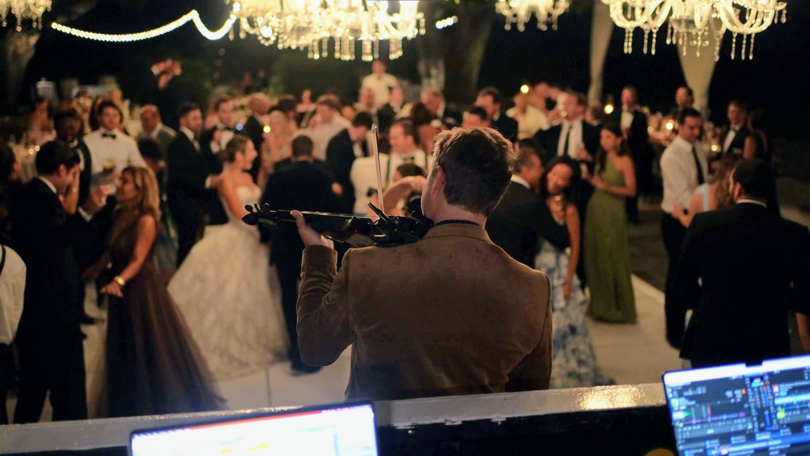 Electric violin feature on a wedding reception dance floor